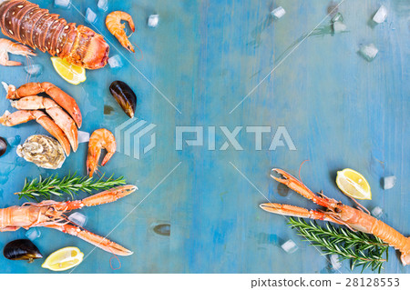 Fresh seafood on blue background 28128553