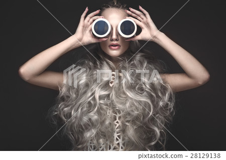 Beautiful girl in art dress and avant-garde 28129138