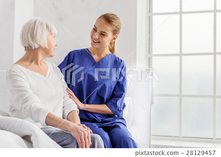 Doctor telling pensioner about her health state Doctor telling pensioner about her health state 28129457