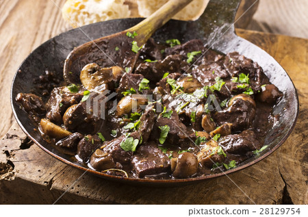 deer meat in wine sauce 28129754