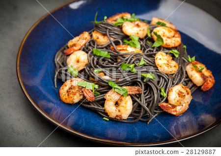 Black pasta with shrimps 28129887