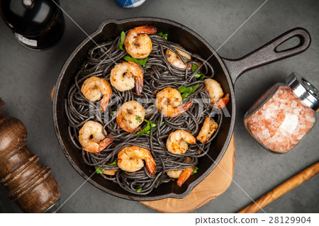 Black pasta with shrimps 28129904