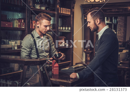 Confident man buying hair care accessories in 28131373