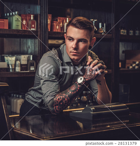 Professional hairstylist in barbershop interior 28131379