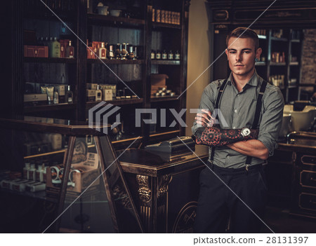 Professional hairstylist in barbershop interior 28131397