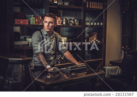 Professional hairstylist in barbershop interior 28131567