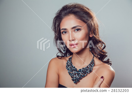 young beautiful woman with make-up in a chic 28132203
