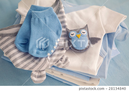 children's clothes with the diapers are stacked children's clothes with the diapers are stacked 28134840