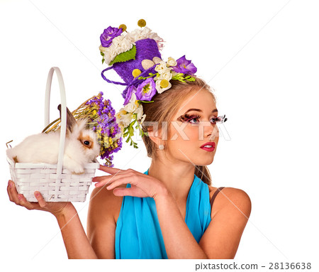 Woman in easter style holding rabbit and flowers Woman in easter style holding rabbit and flowers 28136638