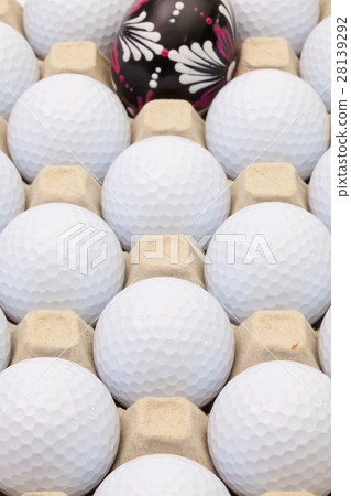 Golf balls in the box for eggs and Easter egg 28139292