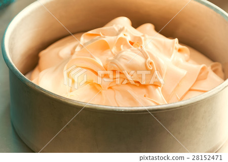 Orange cream cake mixture in the baking tin 28152471