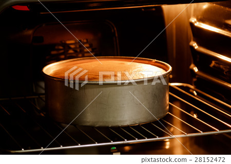 Double layer cake in hot oven ,homemade bake Double layer cake in hot oven ,homemade bake 28152472