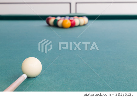 Focus on cue aiming white ball to break billards Focus on cue aiming white ball to break billards 28156123