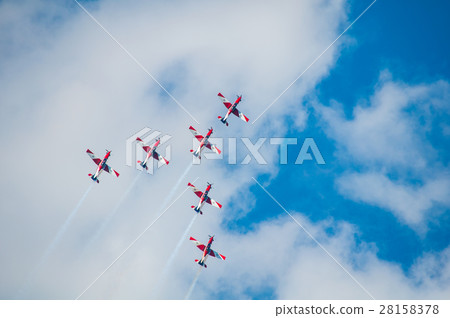 Airplane show - Aerobatic team air show airplane flying in the a Airplane show - Aerobatic team air show airplane flying in the a 28158378