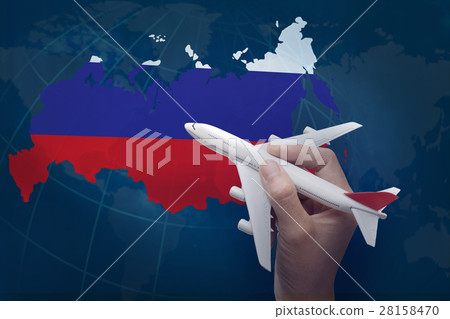 hand holding airplane with map of Russia. 28158470