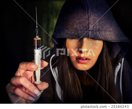 Heroin needle in addict narcotic woman's hand. Heroin needle in addict narcotic woman's hand. 28160243