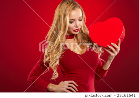 Happiness, valentines day and love concept. elegant woman in red 28161641