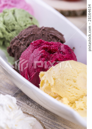 Ice cream blackcurrant with multi-colored balls, o 28164634