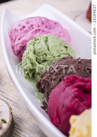 Pistachio ice cream with multi-colored balls on wh Pistachio ice cream with multi-colored balls on wh 28164637