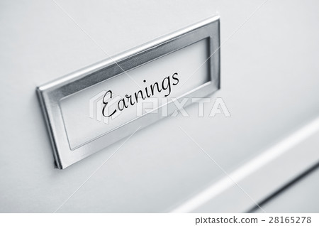 archive cardboard with sticker with word earnings 28165278