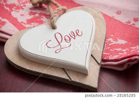 wooden heart on the red tablecloth  28165285