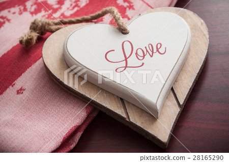 wooden heart on the red tablecloth wooden heart on the red tablecloth 28165290