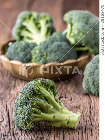 Broccoli.Raw fresh broccoli on old wooden table. Broccoli.Raw fresh broccoli on old wooden table. 28165470
