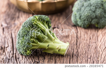Broccoli.Raw fresh broccoli on old wooden table. Broccoli.Raw fresh broccoli on old wooden table. 28165471