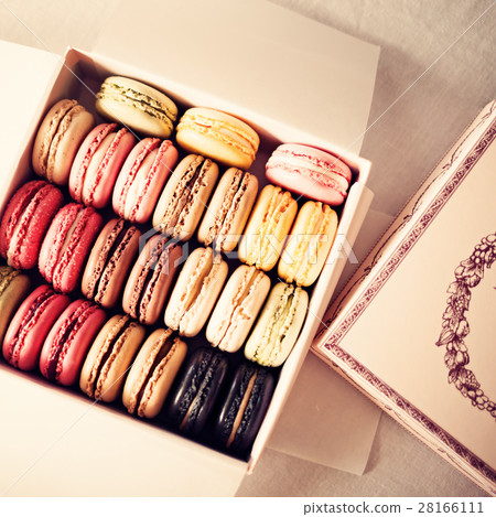 Vintage colorful french macarons in a box Vintage colorful french macarons in a box 28166111