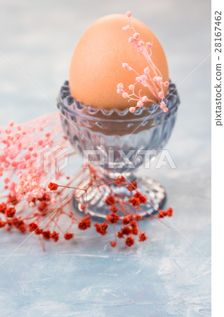 Easter egg in crystal cup, red and pink flowers Easter egg in crystal cup, red and pink flowers 28167462