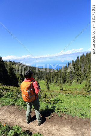 successful hiker hiking on mountain peak successful hiker hiking on mountain peak 28175015
