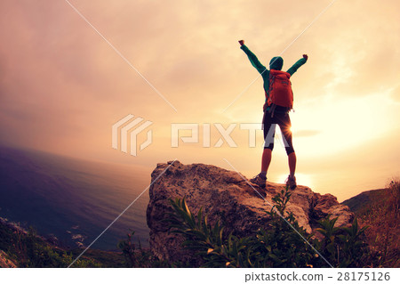 successful hiker hiking on seaside mountain peak successful hiker hiking on seaside mountain peak 28175126