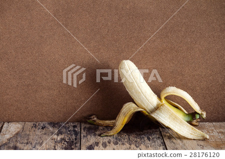 Banana peel on the old wooden. 28176120