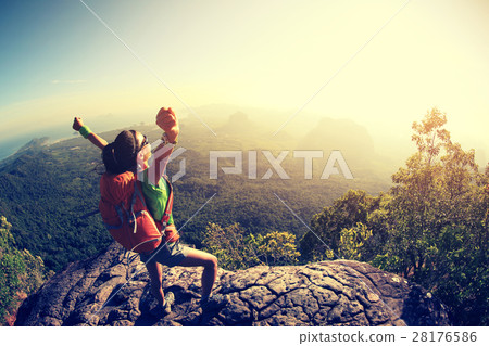 successful hiker hiking on seaside mountain peak successful hiker hiking on seaside mountain peak 28176586