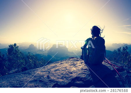 young backpacker sit on the mountain peak rock young backpacker sit on the mountain peak rock 28176588