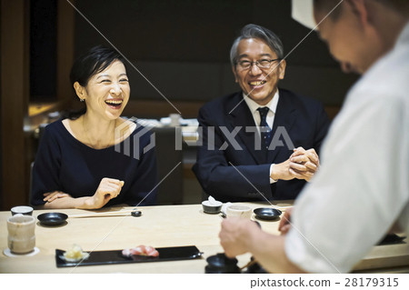 A couple enjoying sushi A couple enjoying sushi 28179315