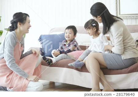 Babysitter and children and working mother 28179640