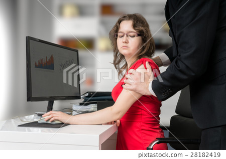 Harassment at workplace. Boss is touching and seducting his secr Harassment at workplace. Boss is touching and seducting his secr 28182419