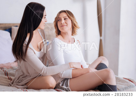 Loving young women sharing a bright morning Loving young women sharing a bright morning 28183233