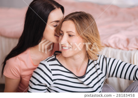 Two close friends sharing secrets Two close friends sharing secrets 28183458