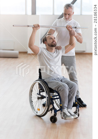 Positive coach teaching and helping the invalid in 28186334