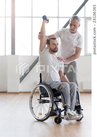 Athletic disabled man training with the coach in Athletic disabled man training with the coach in 28186365