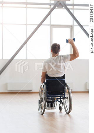 Athletic young invalid exercising with weights in Athletic young invalid exercising with weights in 28186457