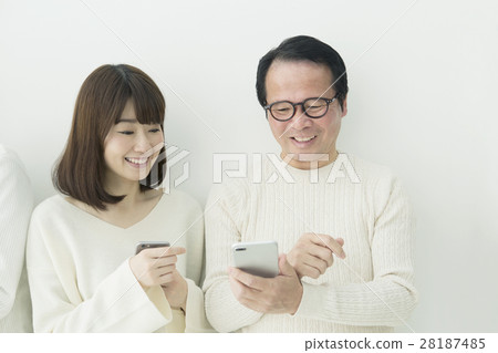 My dad teaches us how to use a smartphone My dad teaches us how to use a smartphone 28187485