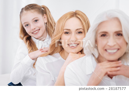 Cheerul delighted family members resting at home Cheerul delighted family members resting at home 28187577