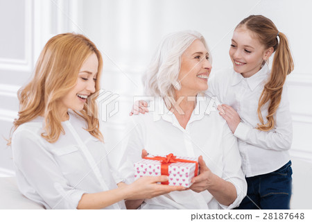 Joyful family members holdign present 28187648