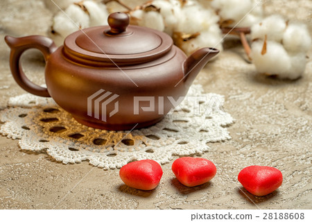 Teapot and three marzipan in the shape of hearts Teapot and three marzipan in the shape of hearts 28188608