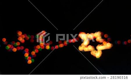 Defocused star-shaped colored lights Defocused star-shaped colored lights 28190316