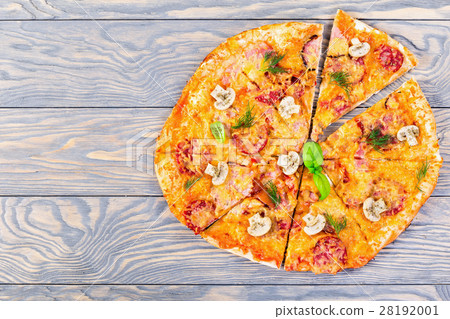 pizza with sausage, ham and cheese, close-up pizza with sausage, ham and cheese, close-up 28192001
