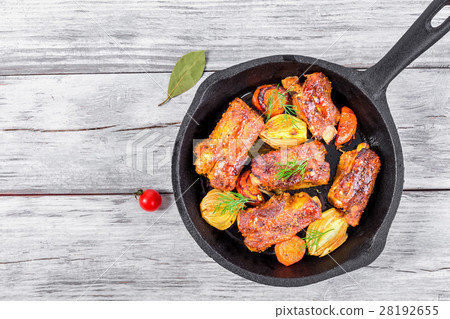 ribs fried in an olive oil in a frying pan ribs fried in an olive oil in a frying pan 28192655